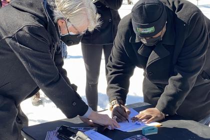 Tyrone signing deed transfer paperwork