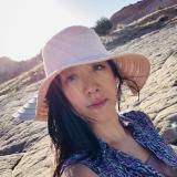 Nancy in a pink hat under the sun